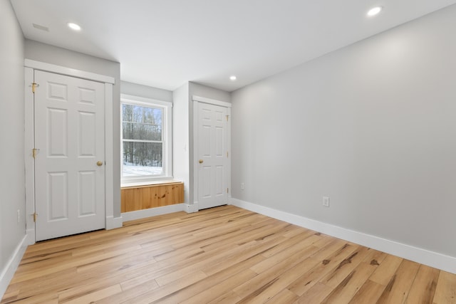 unfurnished bedroom with light hardwood / wood-style flooring