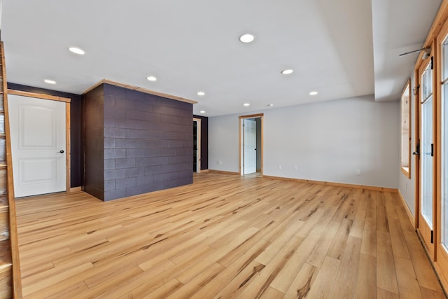 unfurnished living room featuring light hardwood / wood-style flooring