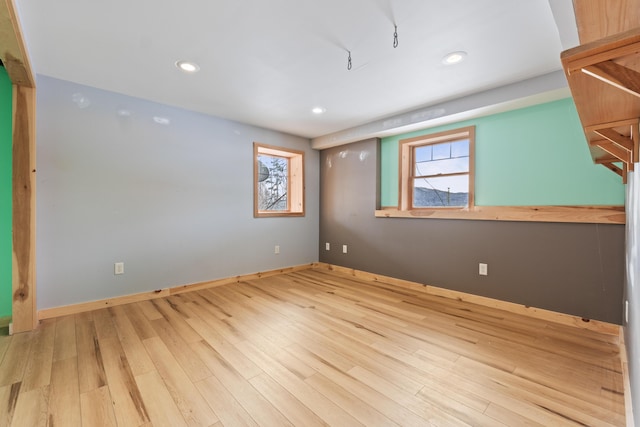 unfurnished room with light wood-type flooring