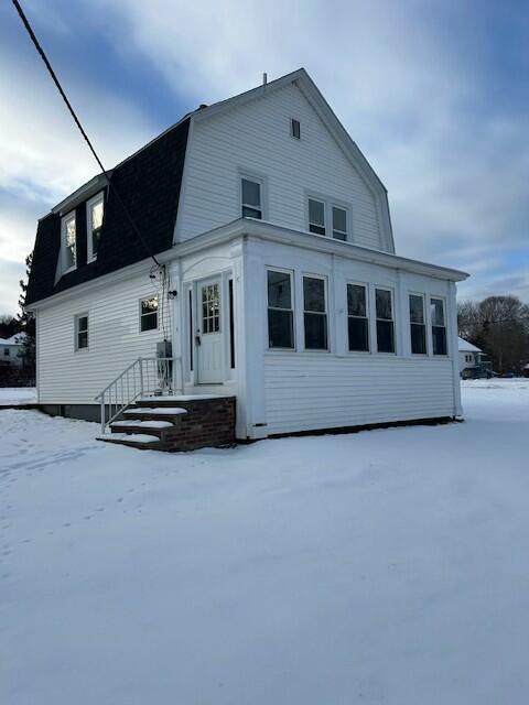 view of snow covered house