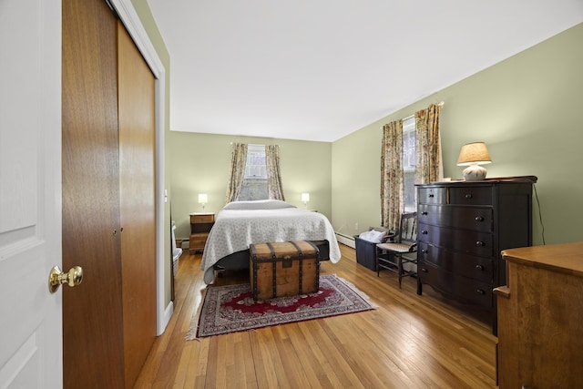 32 Beals Ave, Ellsworth, ME 04605 - bedroom featuring wood-type flooring, a closet, and a baseboard radiator