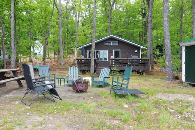 37 Treasure Island Rd, Shapleigh, ME 04076 - view of yard with a fire pit, a deck, and a wooded view