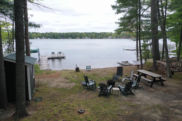 37 Treasure Island Rd, Shapleigh, ME 04076 - dock area featuring an outdoor fire pit and a water view