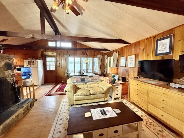 37 Treasure Island Rd, Shapleigh, ME 04076 - living area featuring wood walls, light wood finished floors, and ceiling fan