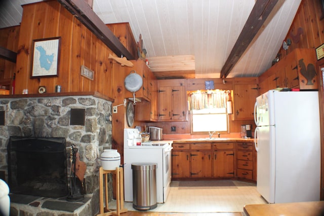 37 Treasure Island Rd, Shapleigh, ME 04076 - kitchen with white appliances, a sink, light countertops, brown cabinets, and wooden walls