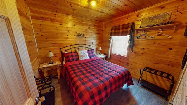 bedroom featuring dark wood-type flooring, wood ceiling, and wooden walls