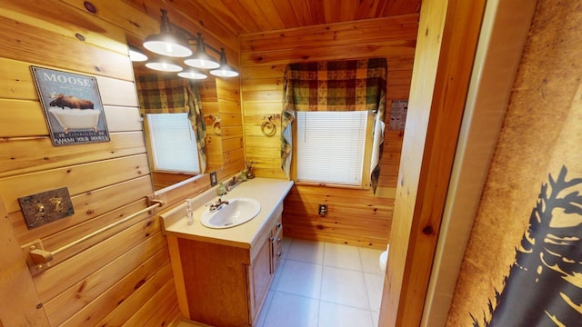 bathroom featuring vanity, wooden walls, tile patterned flooring, and wooden ceiling