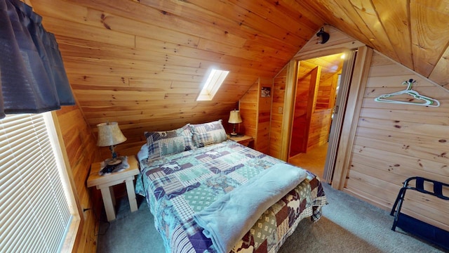 bedroom with wood ceiling, wooden walls, carpet floors, and lofted ceiling with skylight