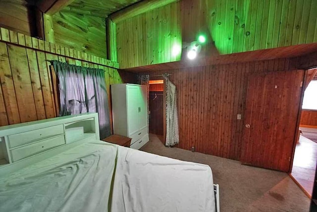 bedroom featuring wooden walls