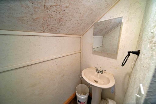 bathroom with lofted ceiling