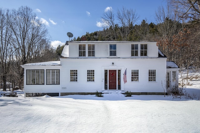 view of front of house featuring a sunroom