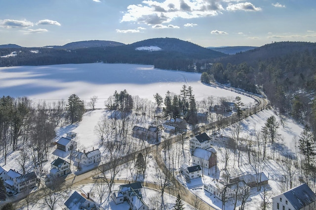 snowy aerial view with a mountain view