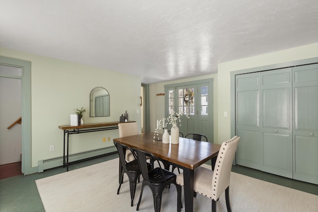 dining space with a baseboard heating unit