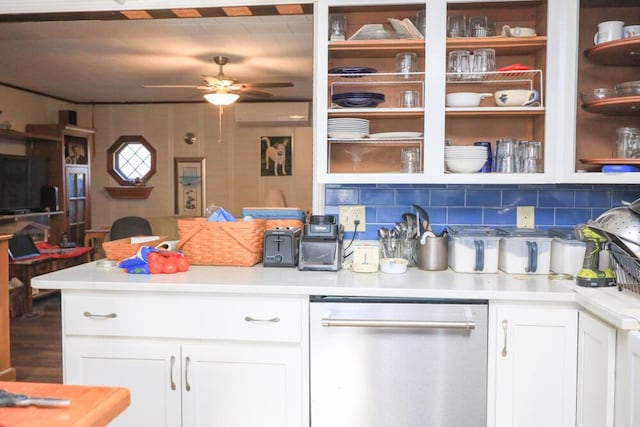 kitchen featuring white cabinets, dishwasher, a peninsula, light countertops, and backsplash