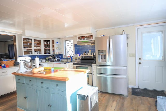 kitchen with tasteful backsplash, appliances with stainless steel finishes, open shelves, and dark wood finished floors