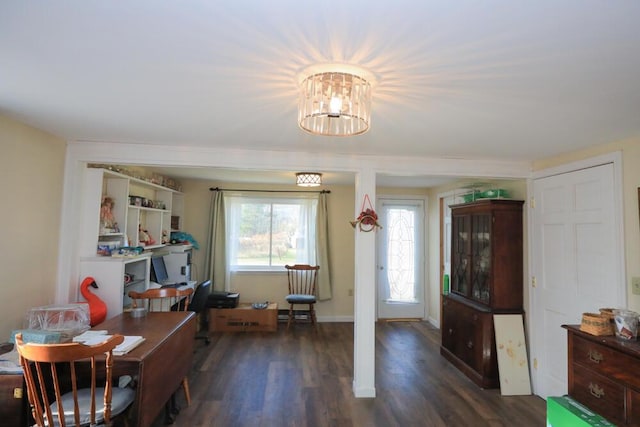 dining room with wood finished floors and baseboards