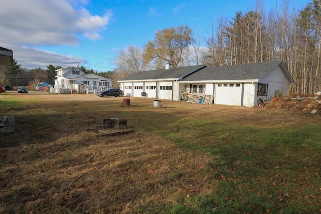 view of front of house featuring a garage and a front yard