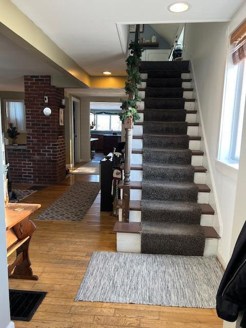 stairs with wood-type flooring