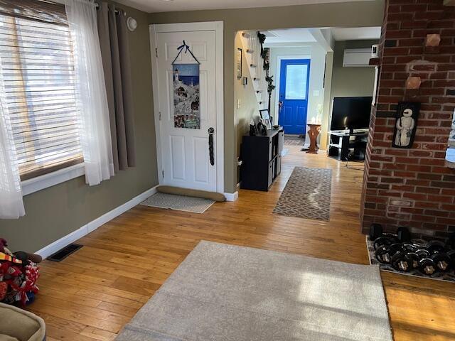 foyer entrance with light hardwood / wood-style floors