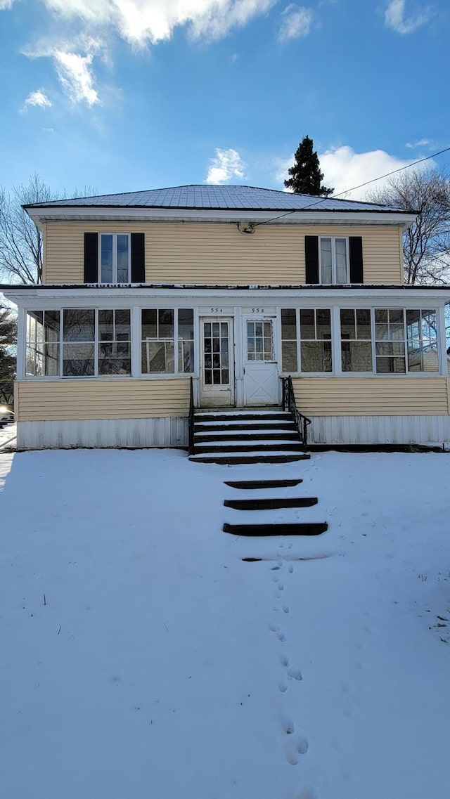 exterior space with a sunroom