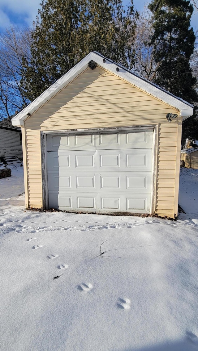 view of snow covered garage