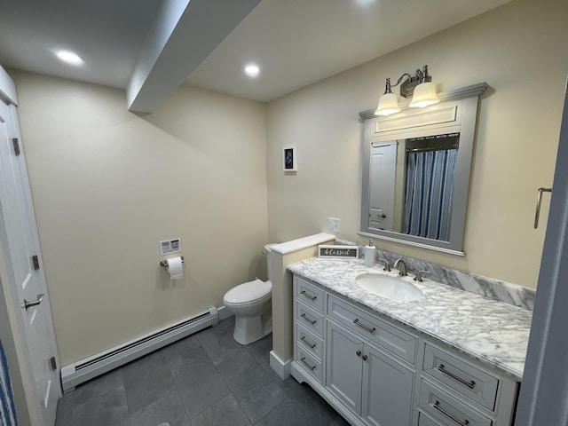 bathroom with a baseboard radiator, toilet, tile patterned floors, and vanity