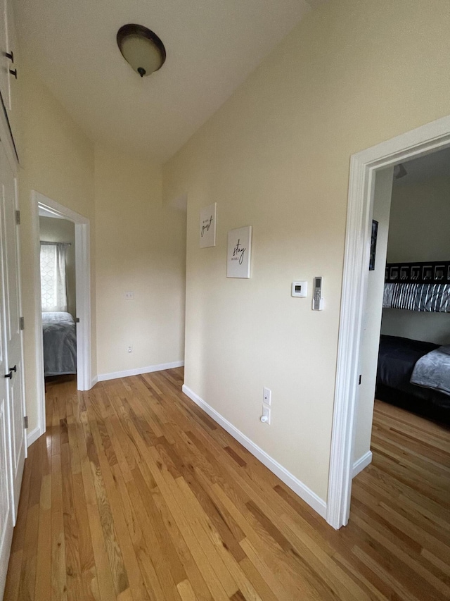 hall with light hardwood / wood-style flooring