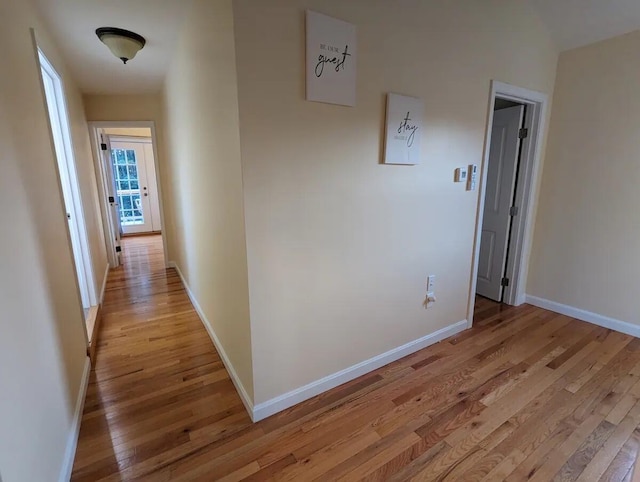 hallway with light wood-type flooring