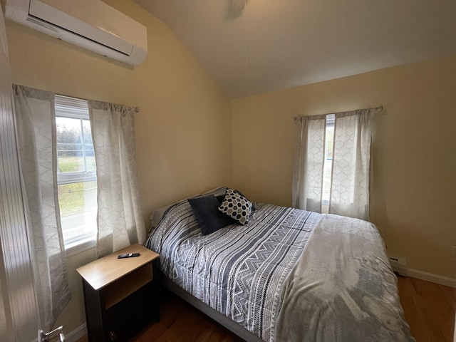 bedroom featuring an AC wall unit, baseboard heating, dark hardwood / wood-style flooring, and lofted ceiling