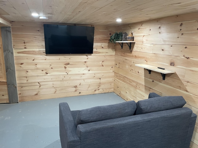 unfurnished room with wooden ceiling and wood walls