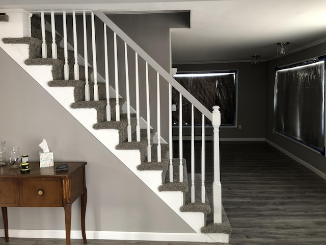 stairs with hardwood / wood-style flooring