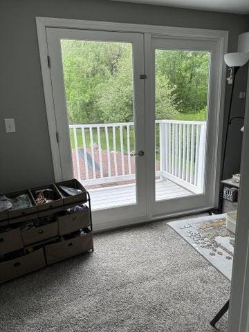 doorway to outside with carpet and french doors