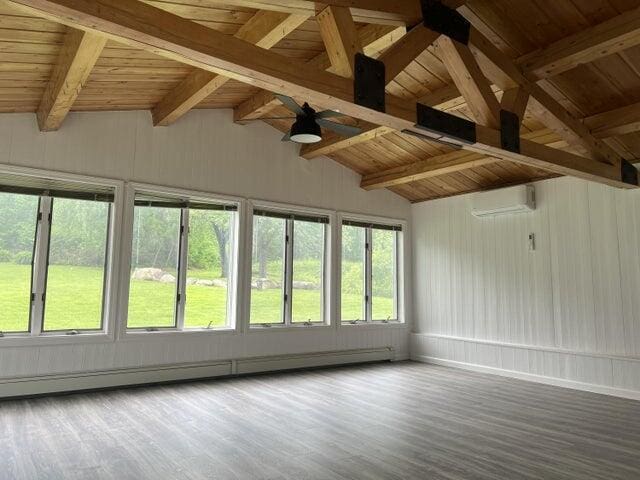 unfurnished sunroom with a baseboard heating unit, wooden ceiling, an AC wall unit, and lofted ceiling with beams