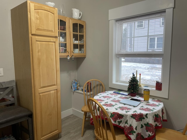 dining area with hardwood / wood-style floors