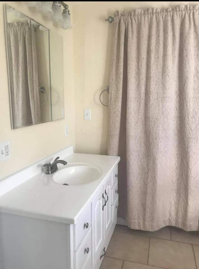bathroom featuring vanity and tile patterned flooring