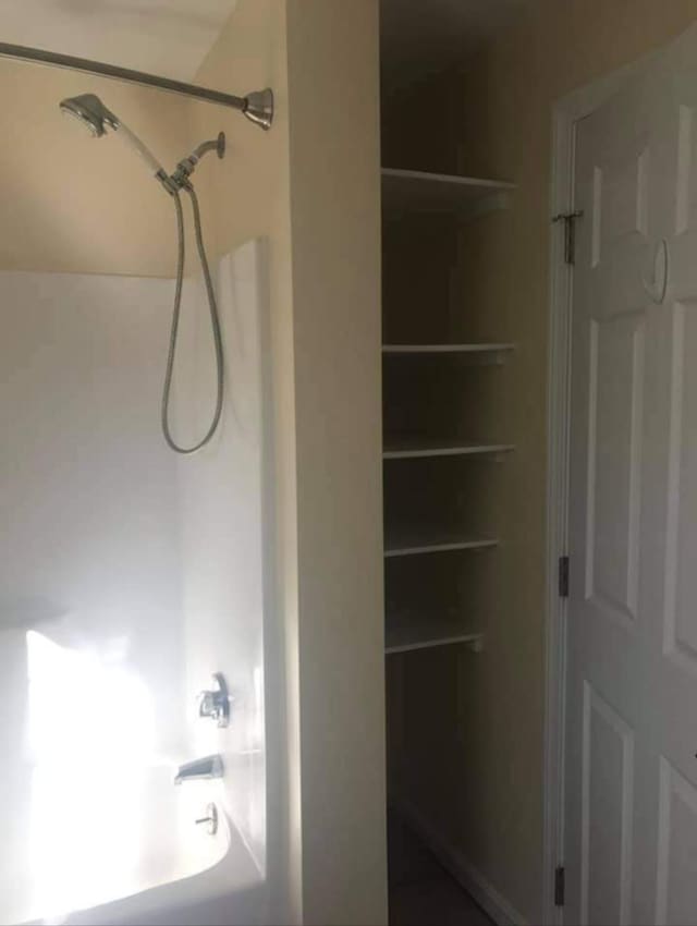 bathroom with shower / bathtub combination