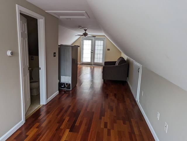 additional living space with dark hardwood / wood-style floors and vaulted ceiling
