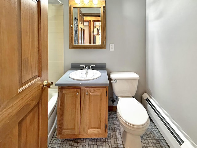 bathroom with baseboard heating, toilet, vanity, and tile patterned flooring