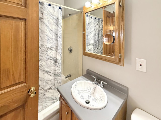 bathroom featuring vanity, toilet, and a shower with shower curtain