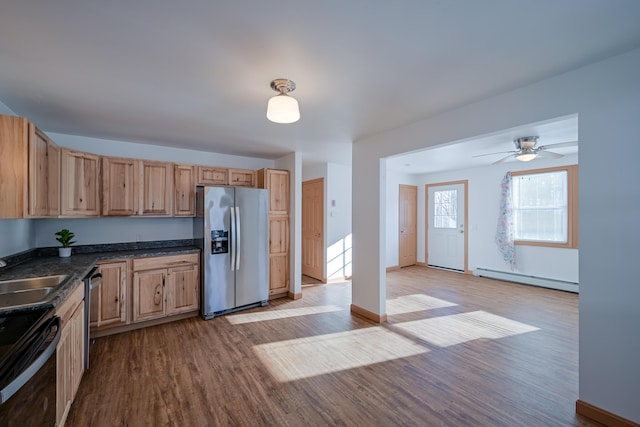 kitchen featuring ceiling fan, light hardwood / wood-style floors, sink, appliances with stainless steel finishes, and a baseboard radiator