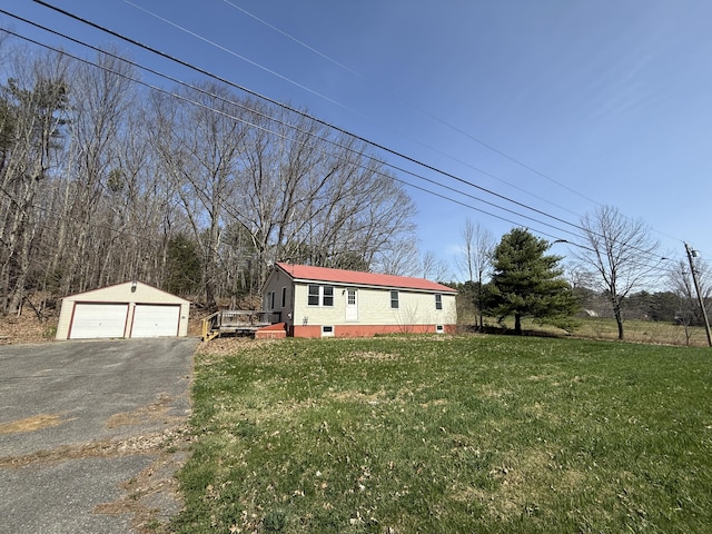 921 China Rd, Albion, ME 04910 - manufactured / mobile home featuring a front lawn, an outdoor structure, and a garage