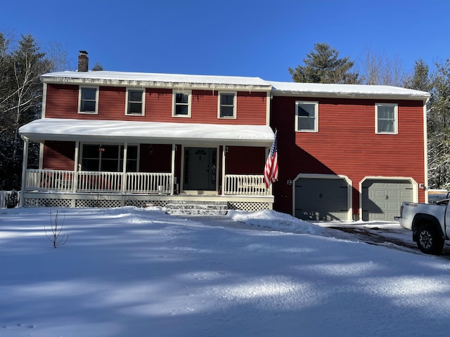 view of front facade with covered porch and a garage