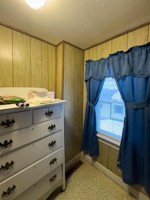 bedroom with wooden walls