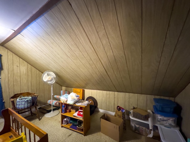 bonus room featuring light carpet, wood ceiling, lofted ceiling, and wood walls