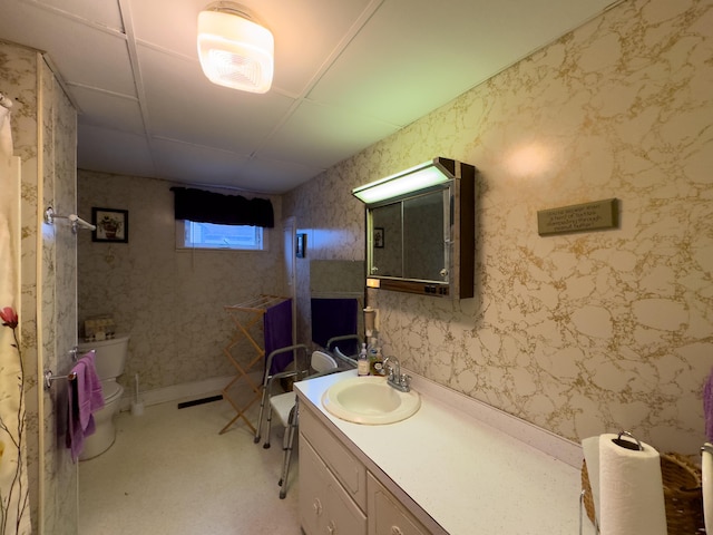 bathroom with toilet and vanity