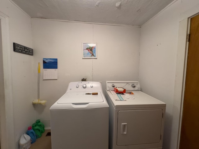 washroom featuring washer and clothes dryer