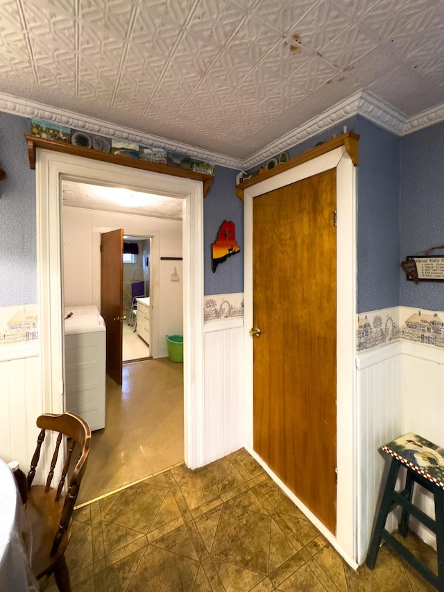 corridor with washer / dryer and crown molding