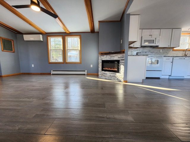 unfurnished living room featuring a wall mounted AC, a fireplace, lofted ceiling with beams, dark wood-type flooring, and a baseboard radiator