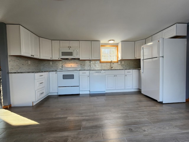 kitchen featuring white cabinets, white appliances, and stone counters