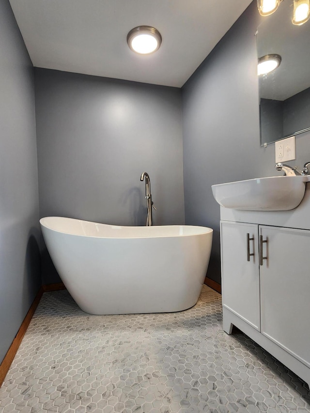 bathroom featuring a tub to relax in and vanity